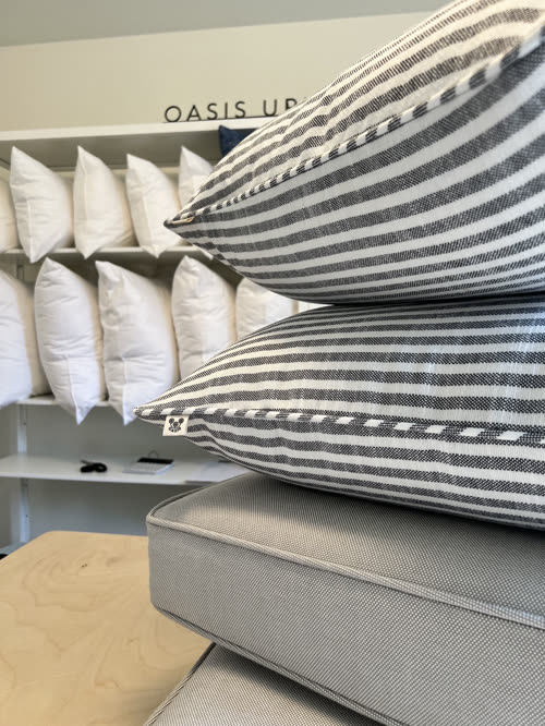Striped custom pillows in the Oasis studio